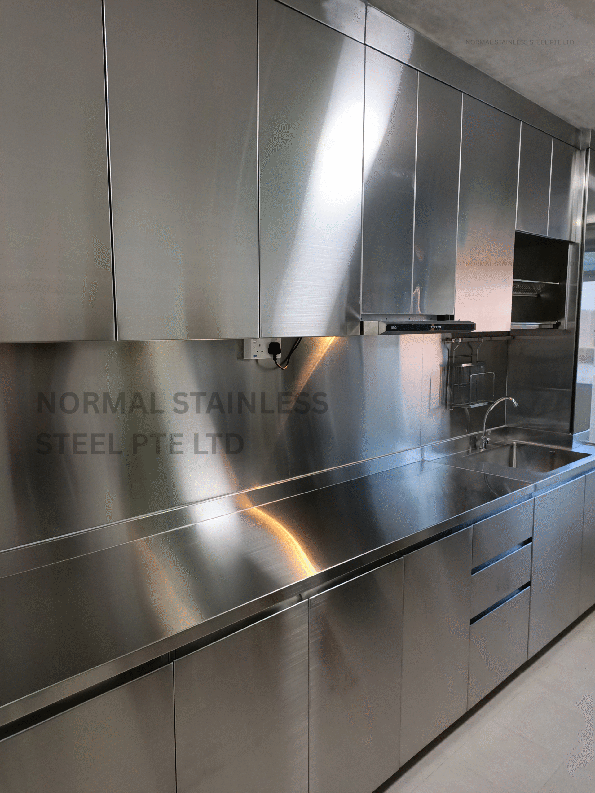 stainless steel top and bottom cabinet with sink and wall cladding